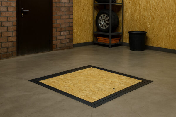 Basement floor hatch with OSB board mounted in concrete garage floor